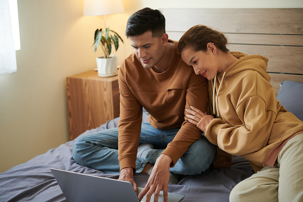 Couple using laptop for online order